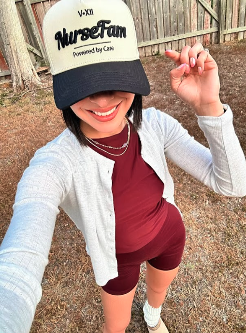 Nurse @toriadanai wearing NurseFam baseball cap outside. Best gift for nurses.